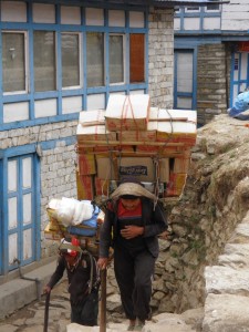 Sherpas carrying a heavy load